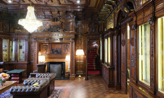 Historic library with carved wood panelling at Les Ambassadeurs Club in Mayfair