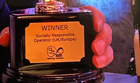Representatives of Les Ambassadeurs Club receiving a Socially Responsible Operator award
